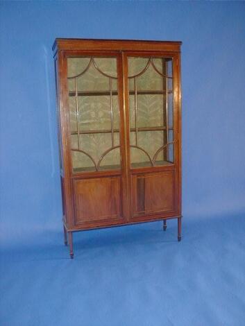 An Edwardian cross banded mahogany display cabinet with two astragal glazed