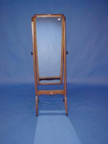 An oak and walnut cheval mirror