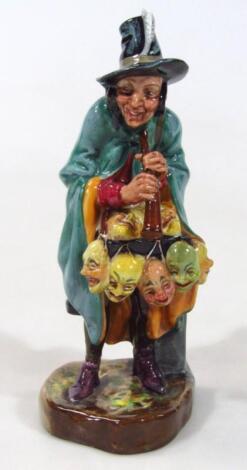 A Royal Doulton figure The Mask Seller