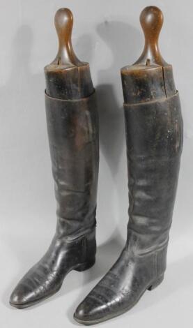 A pair of mid 20thC leather riding boots