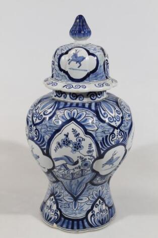 A Dutch Delft blue and white jar and cover