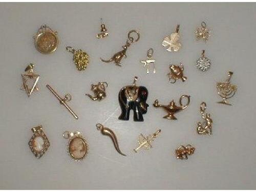 A quantity of loose charms and pendants mostly 9ct