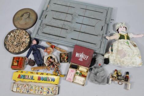 A mid 20thC tin plate and wooden ice hockey game