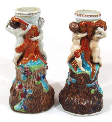 A pair of 20thC majolica style lamp bases