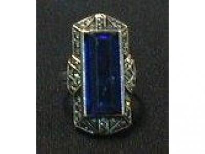 A silver and marcasite Art Deco up finger ring set with a rectangular blue paste