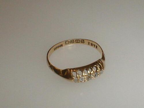 A Victorian 18ct gold gypsy style five stone diamond set ring