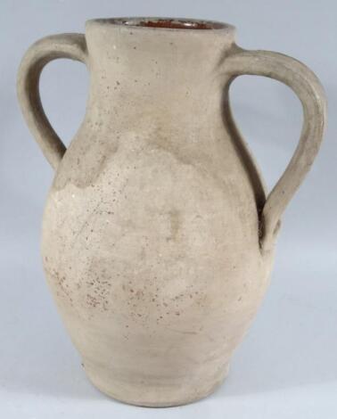 A hand thrown pottery ewer