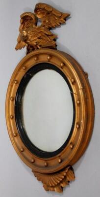 A 19thC gilt wood porthole mirror