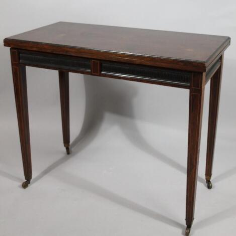 A 19thC rosewood fold over games table