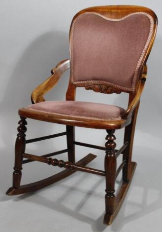 An early 20thC stained rocking chair