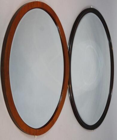 An oval hanging mirror