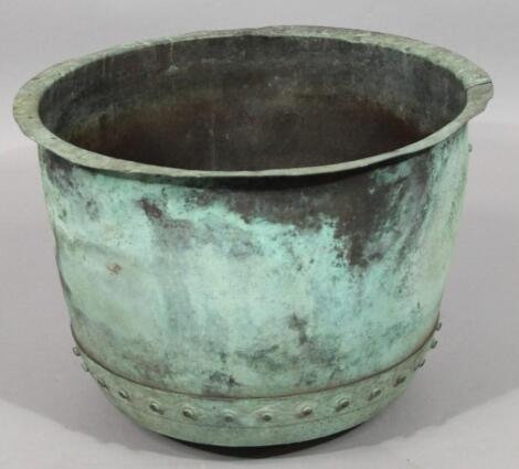 A late 19thC studded copper barrel planter