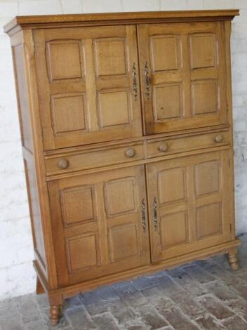 An oak Arts & Crafts freestanding cupboard