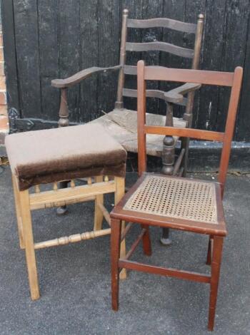 A 19thC rush seated and slat back arm chair