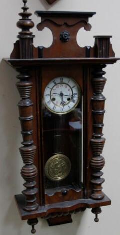 A late 19thC walnut cased Vienna wall clock