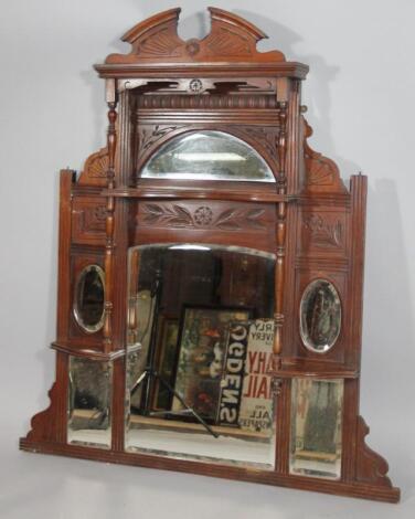 An Edwardian walnut over mantel mirror