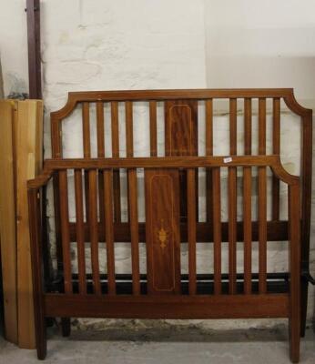An Edwardian mahogany and boxwood strung double bed frame
