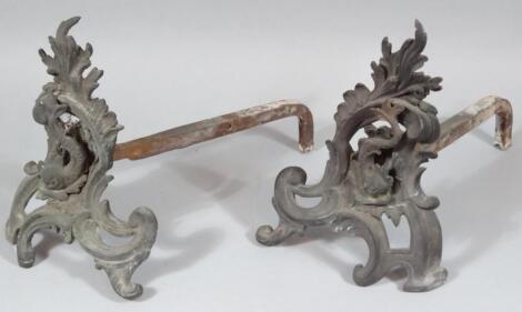 A pair of cast iron fire dogs