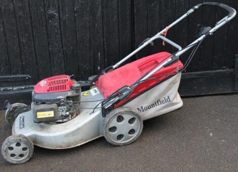 A Mountfield rotary mower with grass box