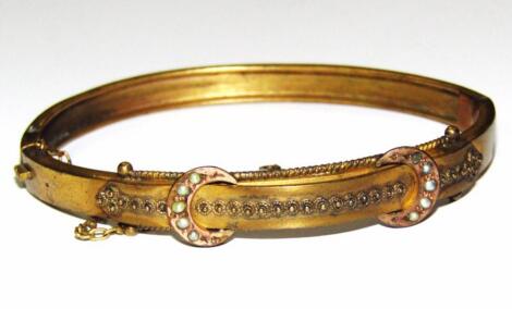 A Victorian bangle set with pearls