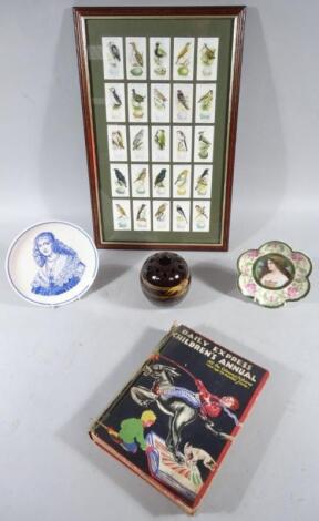 A framed set of cigarette cards