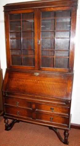 A 1920's oak bureau bookcase