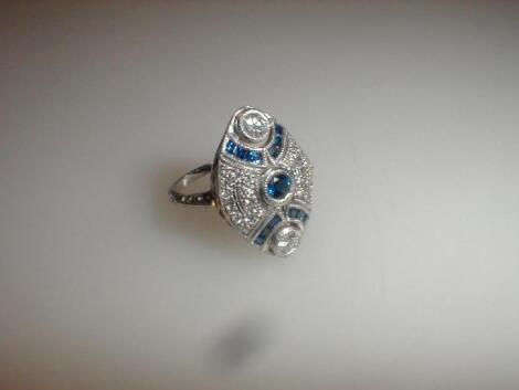 An Art Deco diamond and sapphire set ring of elliptical shape