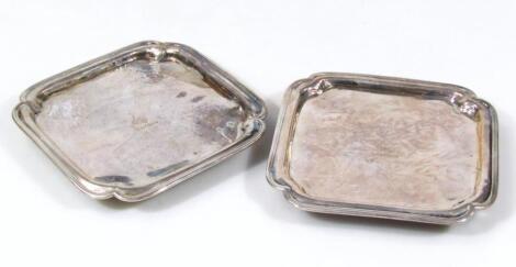 A pair of George III silver waiters