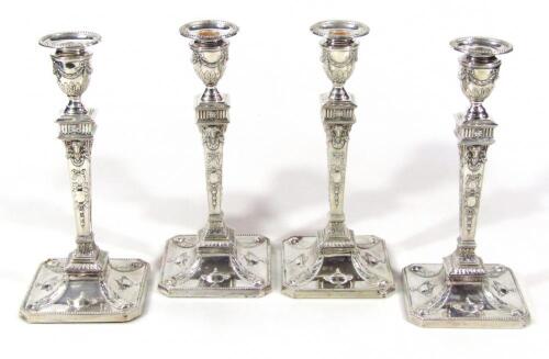 A cased set of four Victorian silver candlesticks