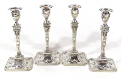 A cased set of four Victorian silver candlesticks