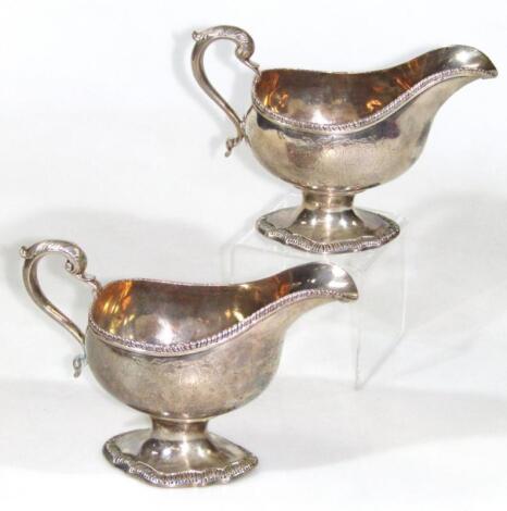 A pair of George III silver sauce boats of large proportion