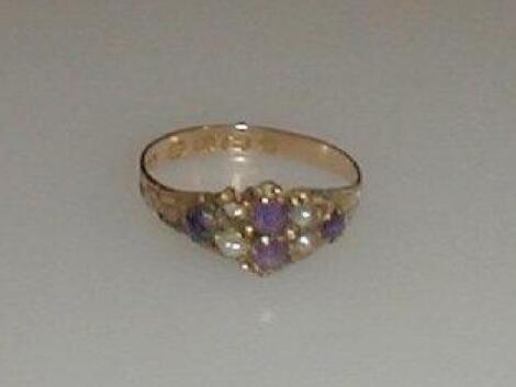 A Victorian amethyst and seed pearl (one missing) set ring