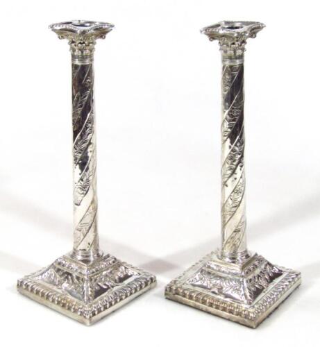 A pair of George III silver candlesticks