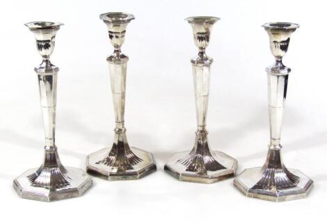 A set of four early 19thC silver candlesticks
