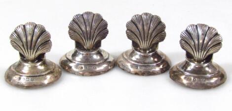 A set of four Edwardian silver menu holders