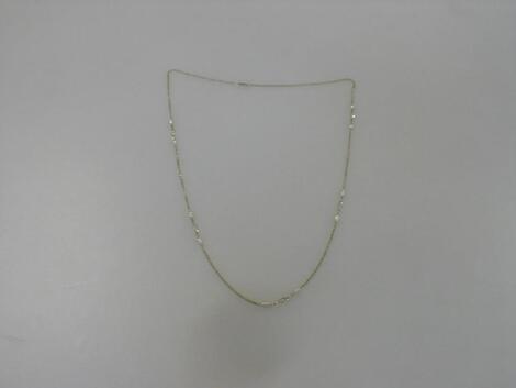 A yellow metal neck chain with freshwater pearls and basket links spaced marked 333