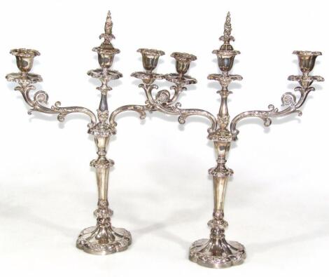A pair of early 19thC Old Sheffield plate metamorphic two branch candelabra