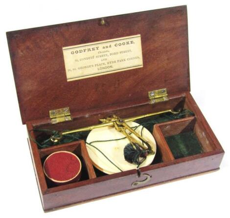 A 19thC mahogany cased set of pocket apothecary scales