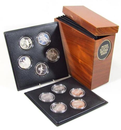 A John Pinches slip case of thirty five silver Peter Scott British Bird Medallion coins