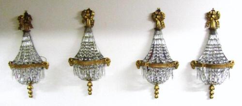 A Harlequin set of four early 19thC Gustavian neo-Classical crystal and giltwood wall sconces