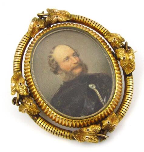 An oval Victorian memorial portrait brooch of a military gentleman