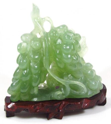 A modern green jade carving of bunches of grapes