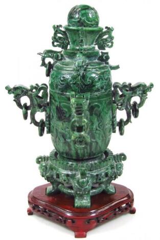A Chinese late Qing period polished spinach jade coloured stone censer and cover