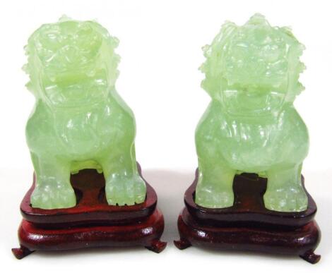 A pair of Chinese carved jade style Dogs of Fo