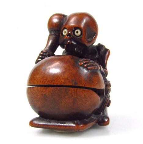 A Meiji period Japanese carved hardwood netsuke