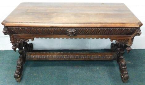 A Victorian carved oak side table