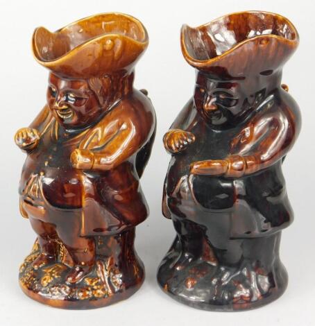 Two similar 19thC Staffordshire treacle glazed snuff taking Toby jugs