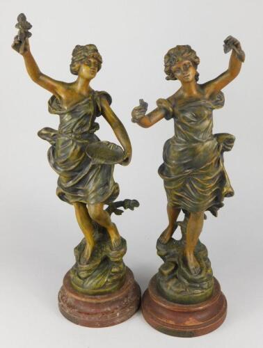 A pair of late 19thC painted spelter figures