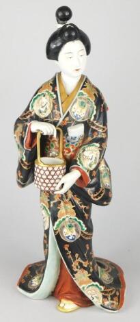 A 19thC Japanese porcelain Meiji figure