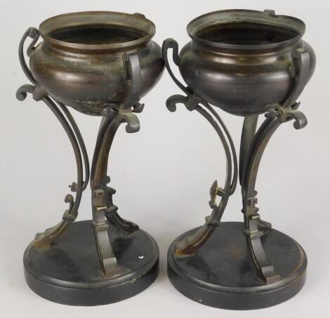 A pair of 19thC bronze urns